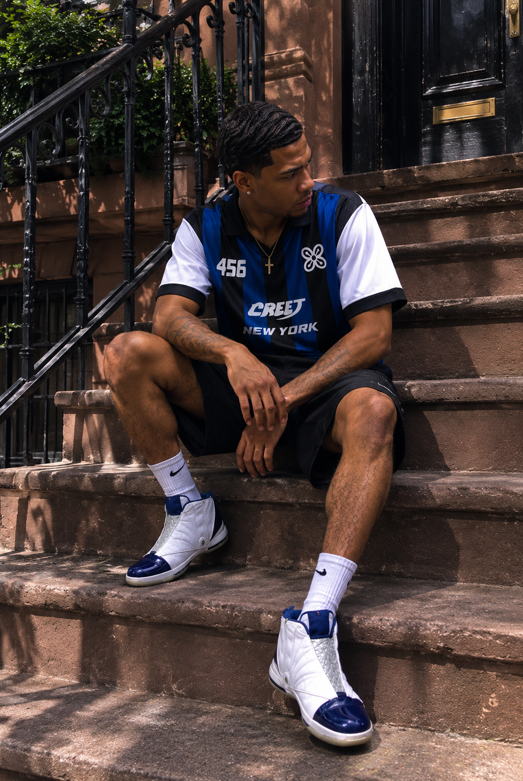 Man wearing CREET 456 blue black and white streetwear jersey in New York