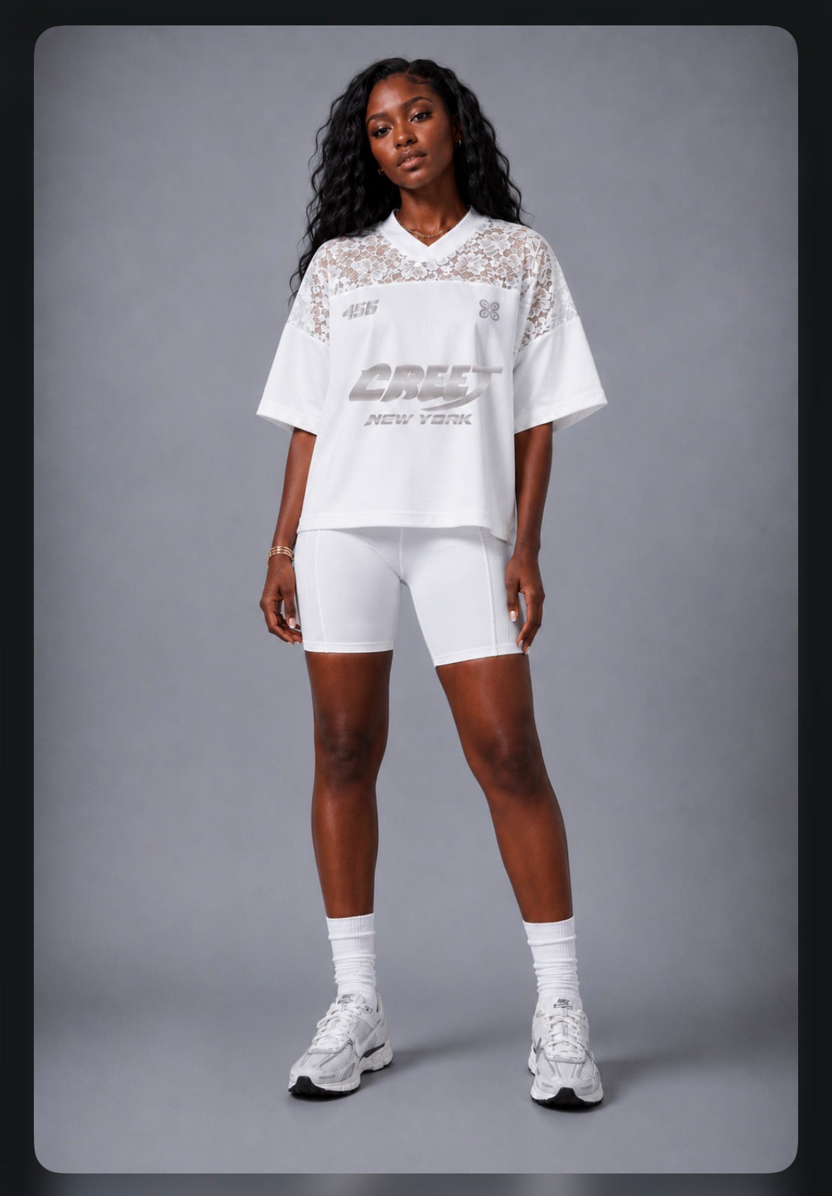 Woman wearing CREET white biker shorts with 456 white lace jersey