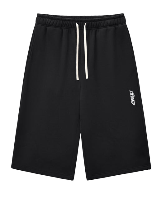 CREET oversized black capri shorts with drawstring waist and signature logo
