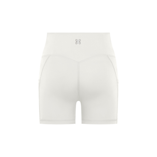 CREET women's white high-waisted biker shorts back view with Abundance logo