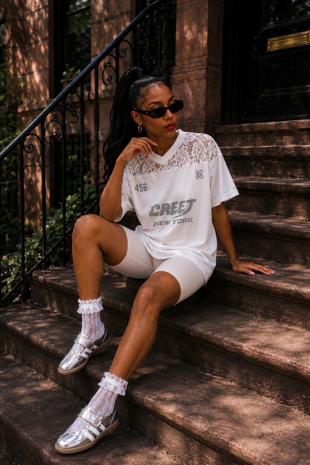Woman wearing CREET 456 white lace jersey and white biker shorts in New York